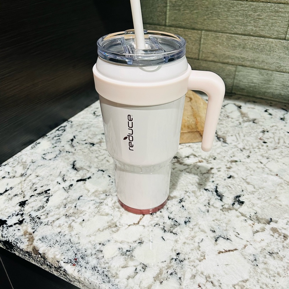 Reduce Pink Tumbler with Handle